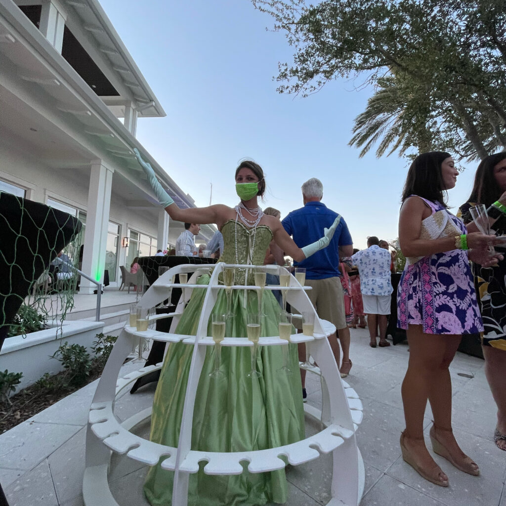 Themed champagne strolling table presentation for a Miami gala event
