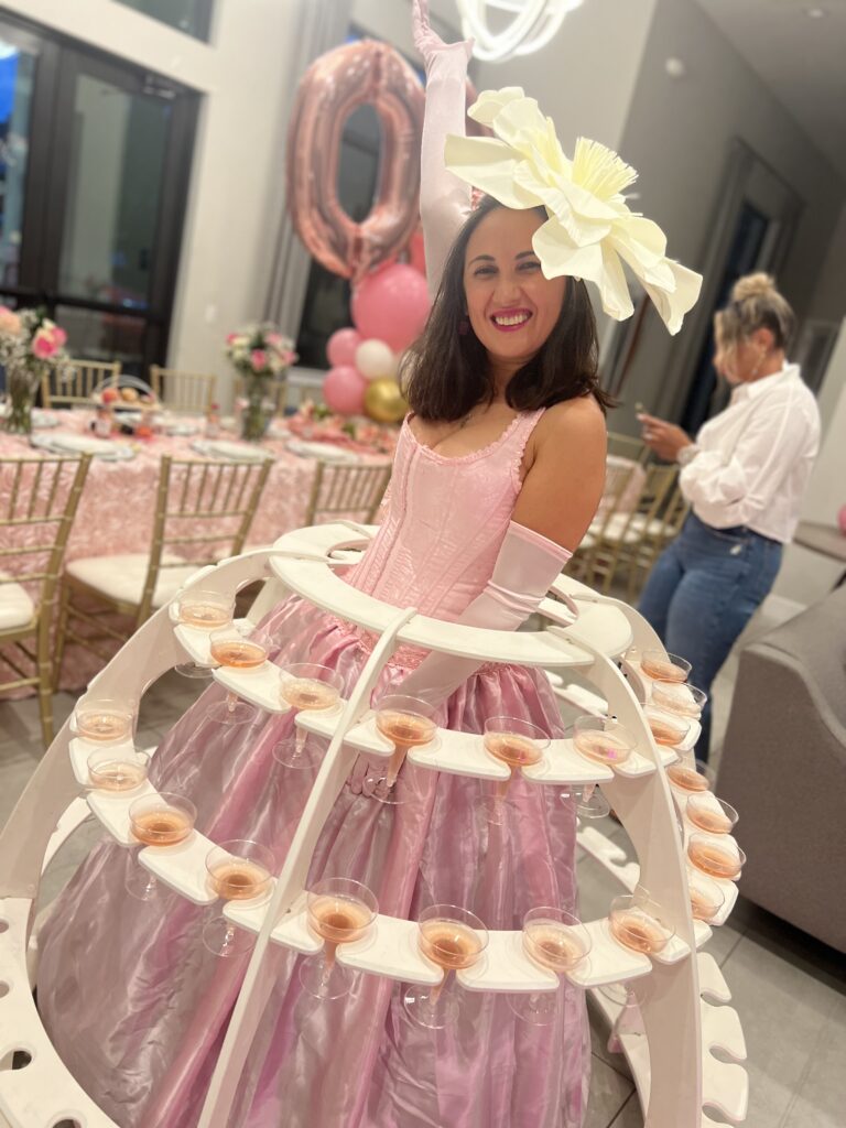 1. Luxury strolling table hostess entertaining guests at an elegant anniversary celebration