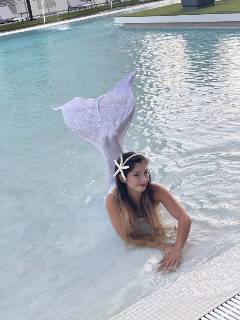 Mermaid entertainer creating a magical atmosphere at a Florida themed party