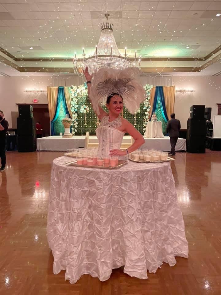 Strolling table performer wearing an elaborate costume at a themed corporate gala
