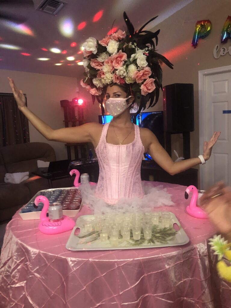 Custom strolling table costume matching the theme of an elegant wedding reception