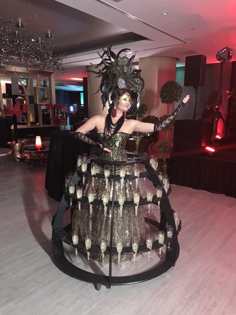 Champagne strolling table entertainer serving guests at an elegant Miami wedding reception