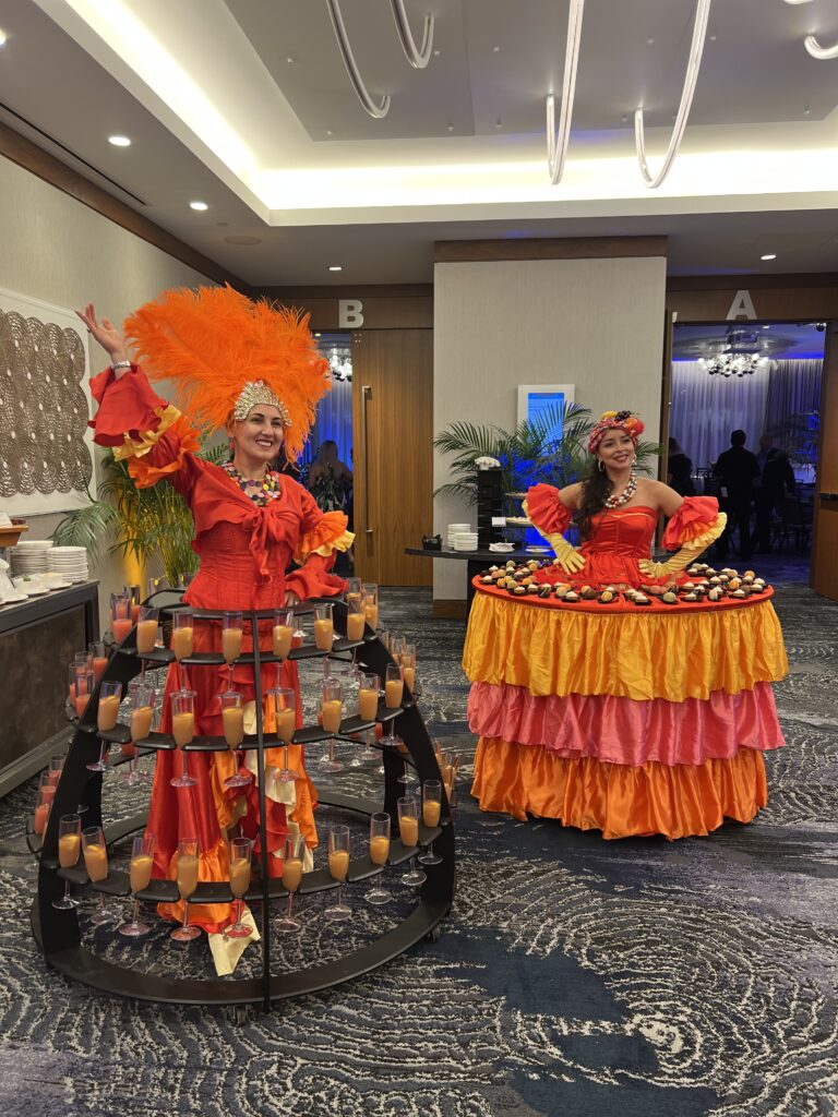 Champagne dress entertainer serving drinks during a luxury wedding reception